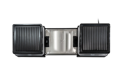 Eine Draufsicht des ausziehbaren Elektrogrills Unold Raclette zeigt zwei schwarze geriffelte Grillplatten auf jeder Seite und eine abnehmbare Tropfschale aus Edelstahl in der Mitte, alles vor einem weißen Hintergrund.