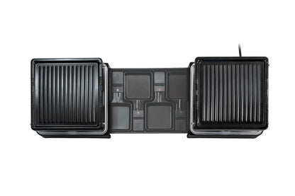 Draufsicht des ausziehbaren Elektrogrills Unold Raclette mit zwei gerippten Grillplatten, einem zentralen Bedienfeld mit Tasten und Kontrollleuchten, auf weißem Hintergrund.