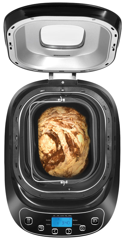 Der Brotbackautomat Unold AG 680101 Backmeister Design (B-Ware), abgebildet mit geöffnetem Deckel und Teig im Inneren, hat ein schwarzes Äußeres, eine Digitalanzeige und Bedientasten auf der Vorderseite.
