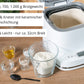 Der Unold AG Backmeister Bernd Brotbackautomat steht auf einer hölzernen Arbeitsplatte neben Glasschalen mit Mehl, Zucker und Wasser und einem schwarzen Messlöffel. Ein deutscher Text hebt die Eigenschaften des Backmeister Bernd hervor.