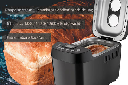 Der Unold Backmeister® Big Brotbackautomat, abgebildet in Schwarz mit geöffnetem Deckel, steht vor einem großen Laib Brot. Der deutsche Text hebt die keramische Antihaftbeschichtung, die herausnehmbare Backform und die Brotgrößenoptionen von 1000 bis 1500 Gramm hervor.