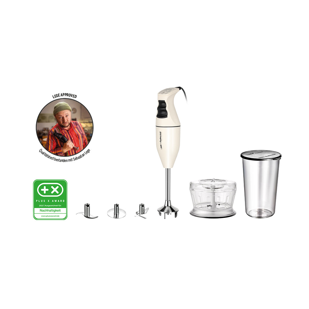 Das Unold ESGE-Zauberstab Bundle E 120 Select Creme Stabmixer-Set verfügt über Aufsätze wie einen Schneebesen, einen Zerkleinerer und einen Mixbecher. Außerdem sind eine grüne Qualitätsauszeichnungsplakette und ein kreisförmiges Bild einer Person in Rot zu sehen, die einen Daumen nach oben zeigt.