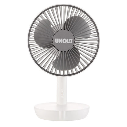 Vor einem schlichten weißen Hintergrund ist ein kompakter, weiß-grauer Tischventilator mit drei Flügeln der Marke „Unold“, Modell TISCHVENTILATOR BREEZY, zu sehen.